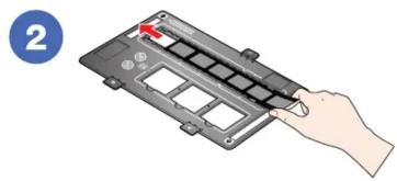 Hand inserting a card into a device with a red arrow indicating the card's left side (no text or symbols present).