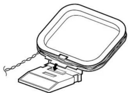 Line drawing of a device with a coiled cable and a rectangular frame (no text or symbols)