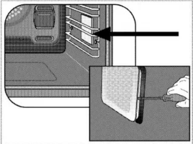 Schéma montrant un panneau de porte inséré dans un appareil, avec une flèche indiquant la direction d'insertion (sans texte ni symboles)
