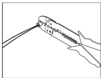 Line drawing of a pair of crimping scissors cutting through a wire (no text or symbols)