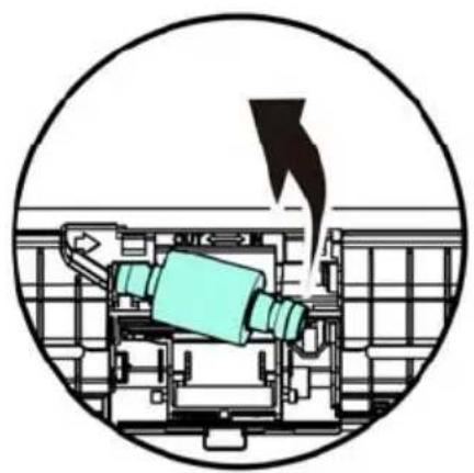 Diagram of a mechanical device inside a circular frame, showing internal components and a downward arrow (no text or symbols)