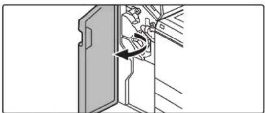 Diagram of a door mechanism with a tool, showing a curved arrow indicating rotation.