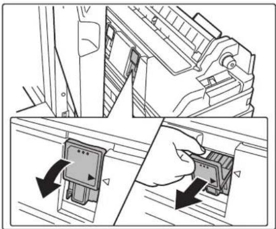 Technical illustration showing a door lock mechanism and a hand inserting a component into a panel (no text or symbols present).