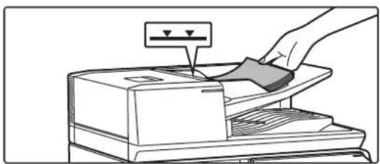 Illustration of a hand using a power tool to press or download a machine (no text or symbols visible)