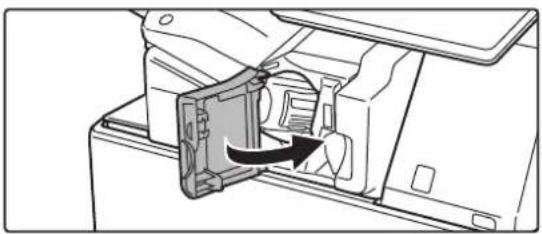 Diagram of a mechanical device with an arrow indicating a component or operation (no text or symbols present)
