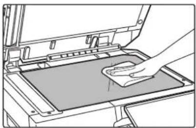 Line drawing of a hand cleaning a clean material inside a machine (no text or symbols)