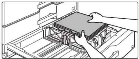 Line drawing of hands installing or adjusting a device into a rack (no text or symbols visible)