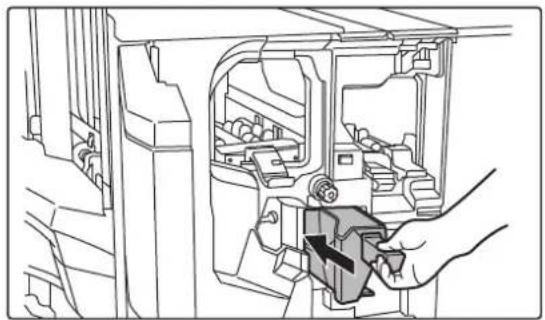 Technical line drawing of a mechanical assembly with a hand inserting a component into a housing (no text or symbols visible).