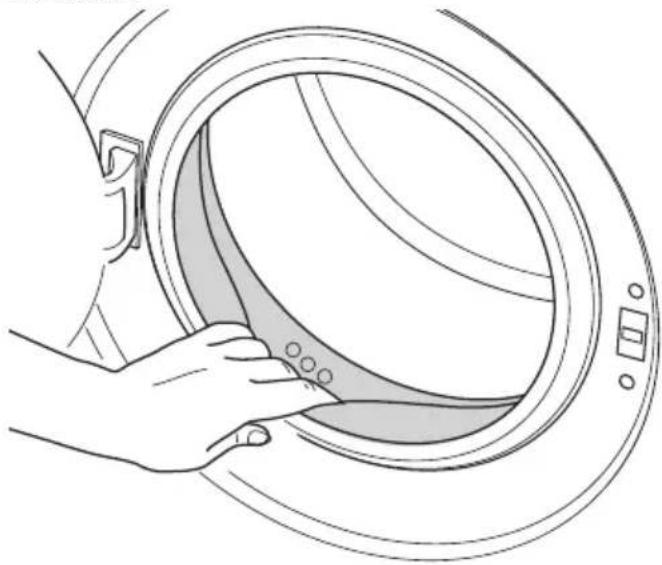 Line drawing of a hand holding a circular device with a handle, showing internal components and mounting points.