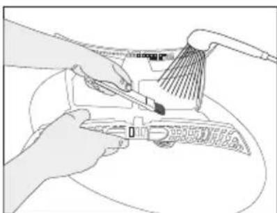 Line drawing of hands using a tool to clean or adjust a component, no text or symbols present.