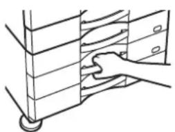Hand placing a wooden shelf item into a rack (no text or symbols visible).