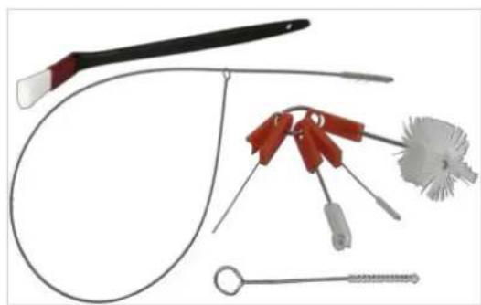 Medical or laboratory medical tools including a needle, tubing, and forceps (no text or labels visible).