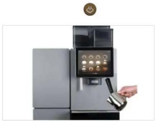 Hand pouring liquid into a modern kitchen appliance with digital display (no visible text or symbols).