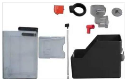 Collection of various electronic components and accessories including a plastic holder, plastic clip, and mechanical parts (no text or symbols visible).