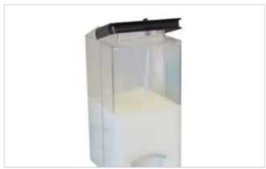 Transparent plastic container with a black lid, containing a white liquid and a small amount of yellow liquid.
