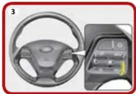 Interior view of a car steering wheel and dashboard (no visible text or symbols)