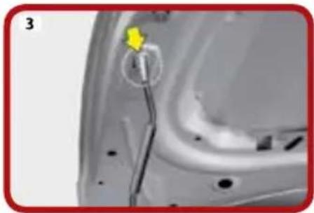 Close-up of a car's side panel with a yellow arrow pointing to a component, no visible text or symbols