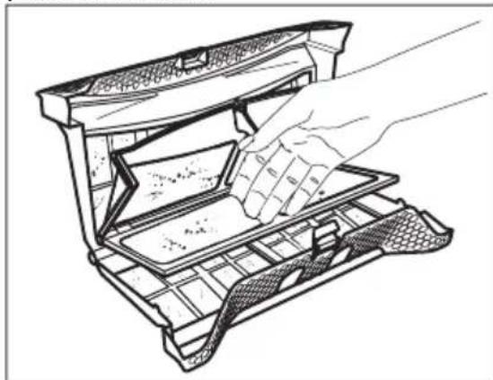 Line drawing of a hand inserting a plastic tray into an open drawer (no text or symbols).