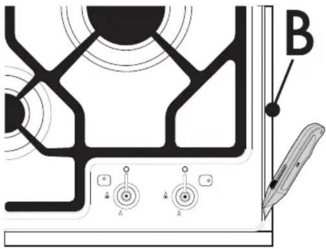 Technical diagram showing a target or targeting mechanism with labeled components and directional arrows, including a tool labeled 'B' pointing to the target.