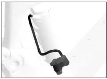 Close-up of a black plastic connector with a curved black line, no visible text or symbols