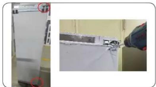 Exterior view of a refrigerator with a hand operating the door panel (no visible text or symbols)