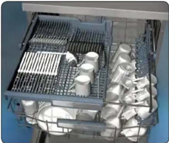 Interior view of a stainless steel kitchen appliance with metal grilles and stacked cylindrical containers (no visible text or symbols)