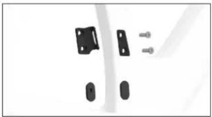 Close-up of black plastic components including a bracket, screw, and oval (no text or symbols visible)