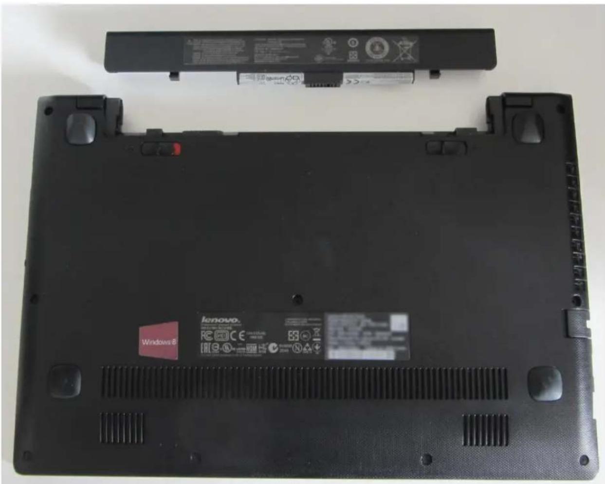 Laptop back panel with Lenovo branding and battery pack, no visible text or symbols on the main body