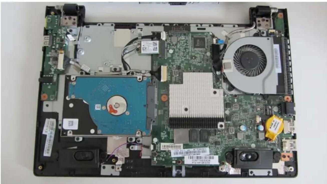 Top-down view of a computer motherboard showing internal components like CPU, RAM, and heatsink (no readable text or symbols)