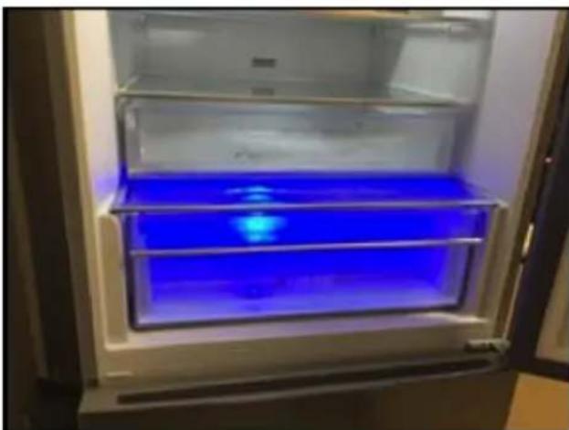 Interior view of a refrigerator with blue-lit interior (no text or symbols visible)