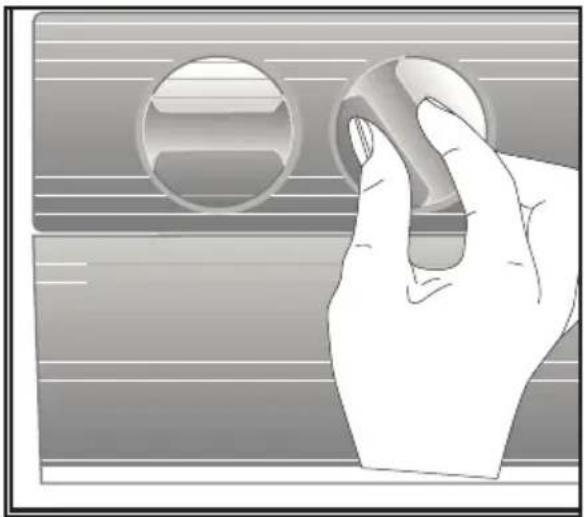 Illustration of a hand pressing down on a circular object with horizontal lines (no text or symbols)