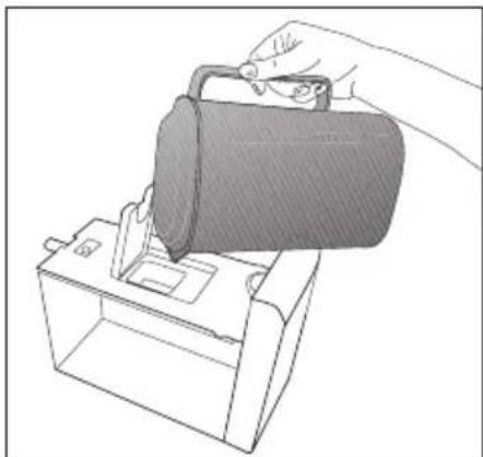 Line drawing of a hand inserting a device into a box (no text or symbols)