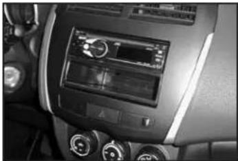 Interior view of a car dashboard with air conditioners and controls (no visible text or symbols)