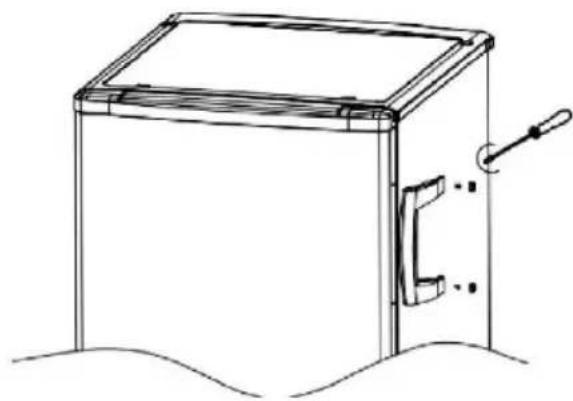 Line drawing of a rectangular box with a handle and side panel, placed on a surface (no text or symbols)