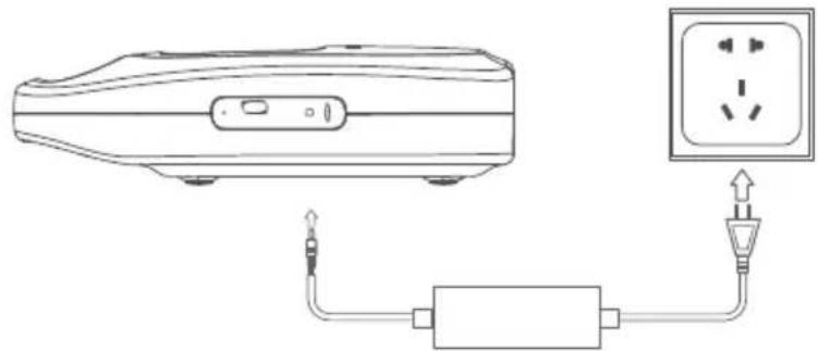 Line drawing of a portable electronic device connected to an electrical outlet (no text or symbols)