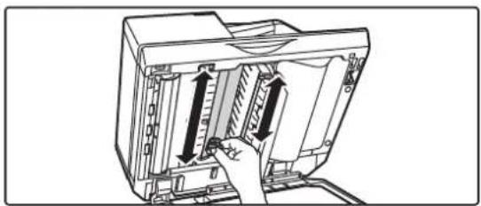 Illustration of a computer monitor with an open panel and a hand inserting a cable (no text or symbols visible).