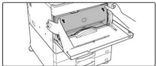 Illustration of hands installing or opening a device into a rack (no text or symbols visible)