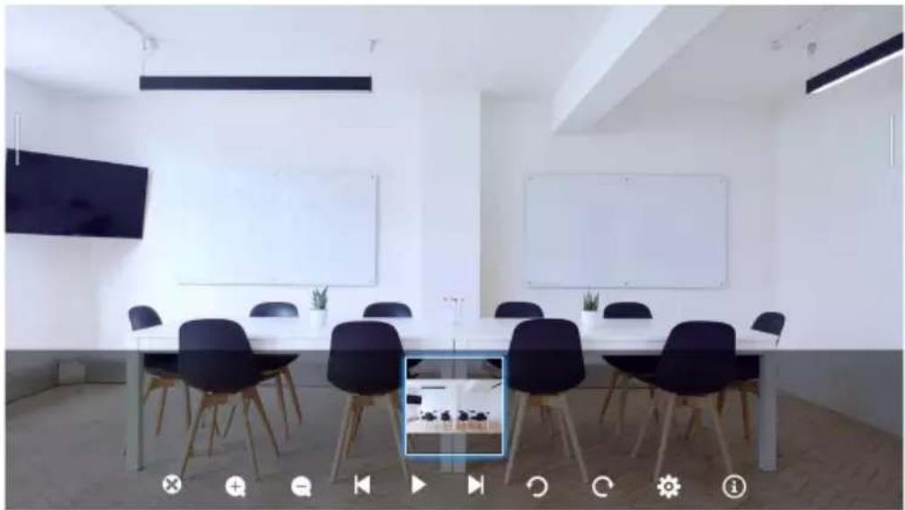 Interior view of a modern meeting room with white walls, black chairs, and a large whiteboard (no visible text or symbols)