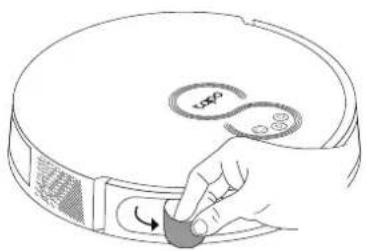 Hand placing a button on a circular device with a scroll wheel (no text or symbols visible)