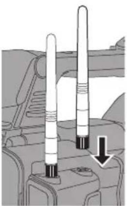 Mechanical component diagram showing two vertical cylindrical sensors mounted on a base, with one sensor pointing downward (no text or symbols present)