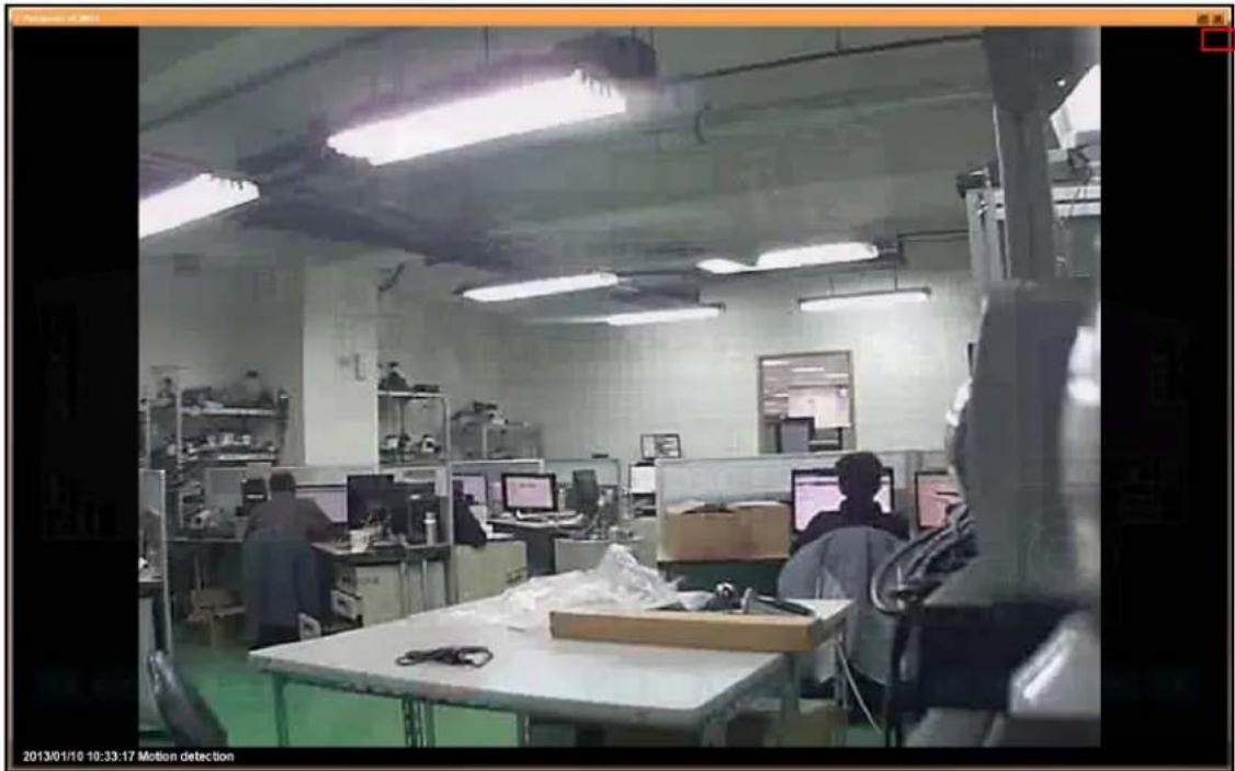 Interior view of a factory or lab with workers at workstations and computer monitors (no visible text or symbols)