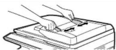 Illustration of hands using a tool to press or install a rectangular object (no text or symbols visible)