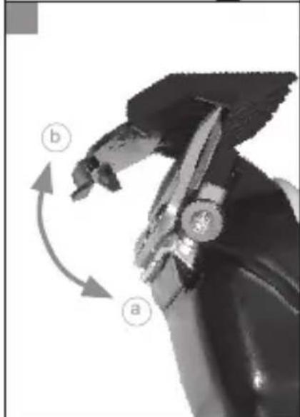 Close-up of a mechanical component with labeled parts (a and b) and directional arrows indicating motion or rotation (no text or symbols beyond labels)