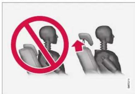 Diagram showing a no-prohibition sign over human head and neck positions, with an upward arrow indicating movement or pressure.