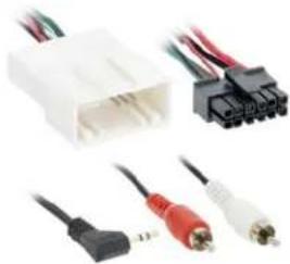 Close-up of various electronic components including a white connector, black connectors, and red/red audio/video cables (no text or symbols visible)