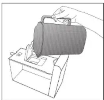 Illustration of a hand inserting a bag into a device (no text or symbols visible)