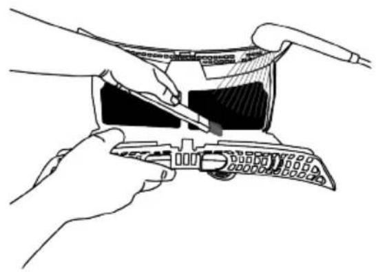 Line drawing of hands using a tool to adjust or install a device (no text or symbols visible)