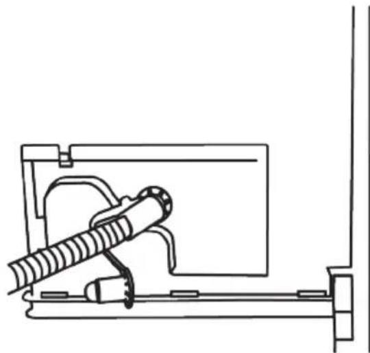 Technical line drawing of a mechanical device with a cylindrical component mounted on a frame (no text or symbols)