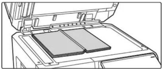 Line drawing of an open printer with a stack of documents inside (no text or symbols)