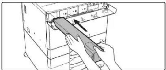 Illustration of hands inserting a device into a rack, showing internal components and an arrow indicating direction (no text or symbols)